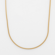Gold minimalistic chain necklace on a white background