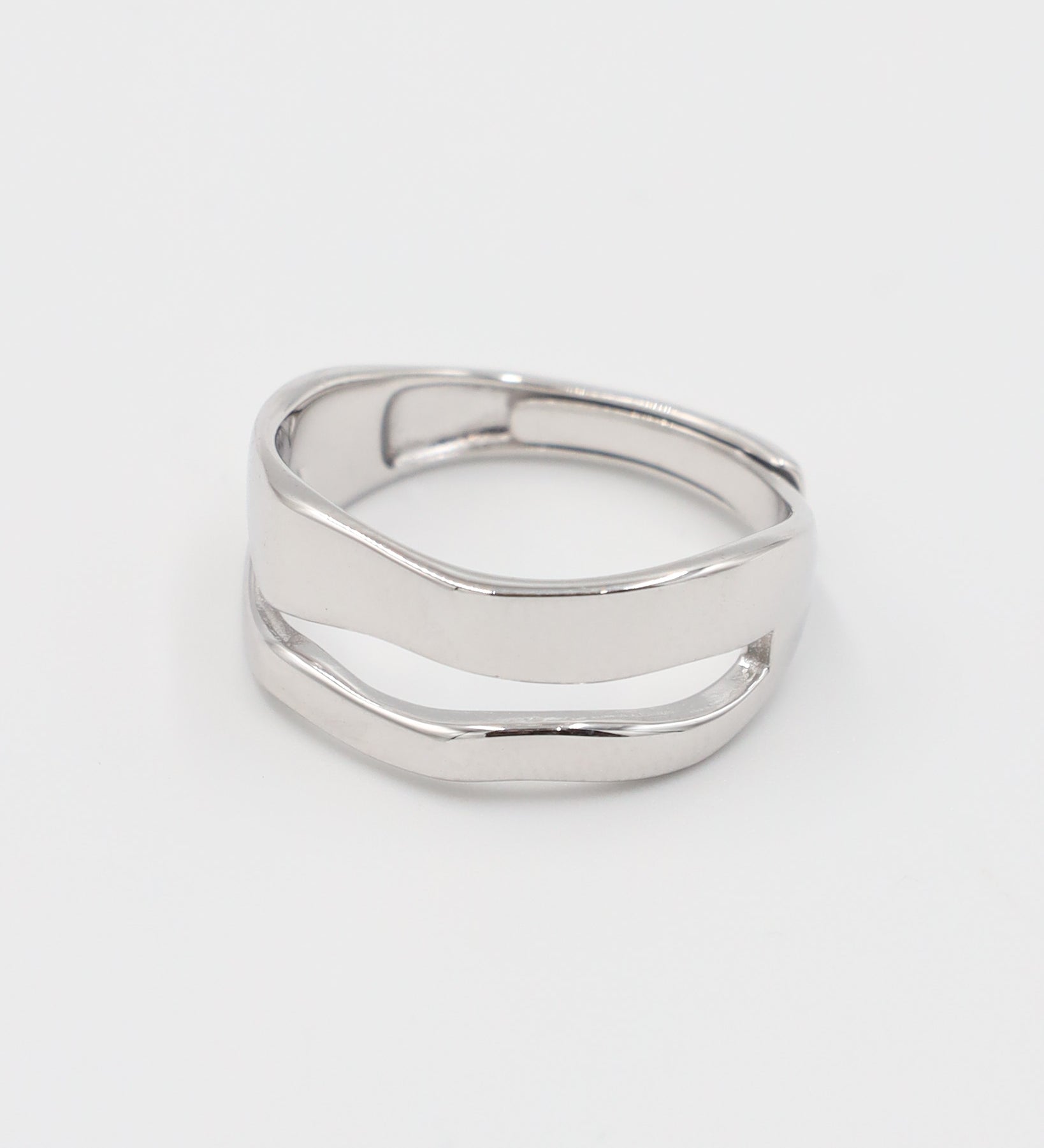A simple silver ring with a smooth, flat surface and no visible brand marking.