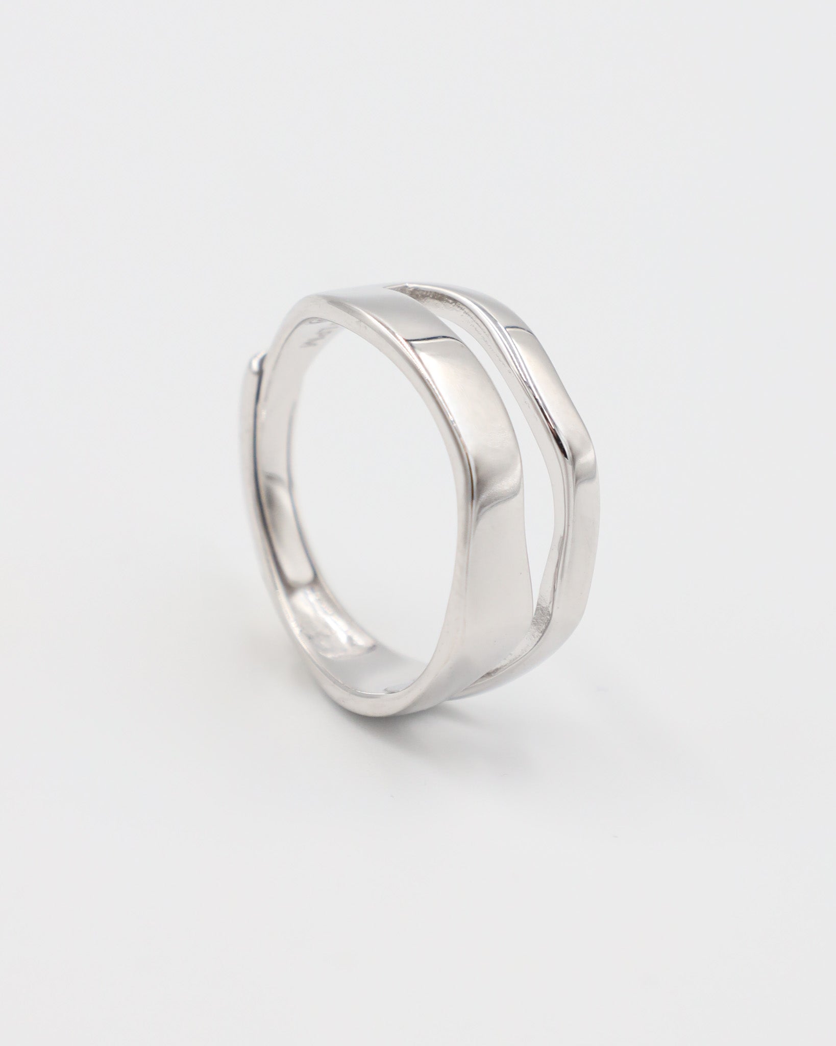 A simple silver ring with a smooth, flat surface and no visible brand marking.