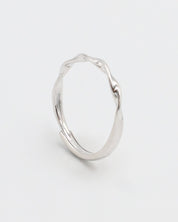 A silver ring with a simple, modern design displayed against a white background.