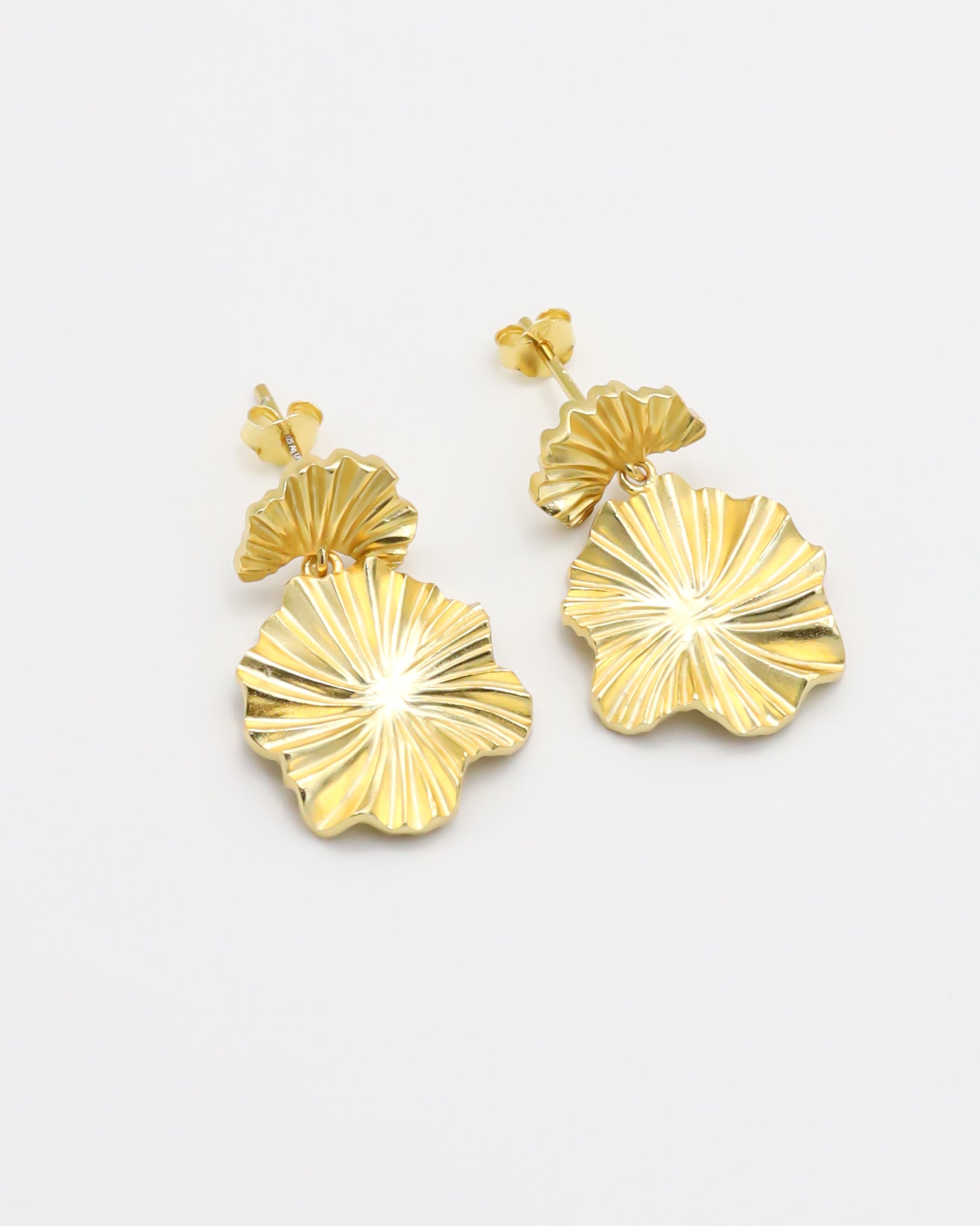 A pair of gold-colored floral design earrings with a butterfly clasp closure.