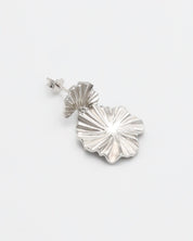 A single silver stud earring with a butterfly clasp and floral design