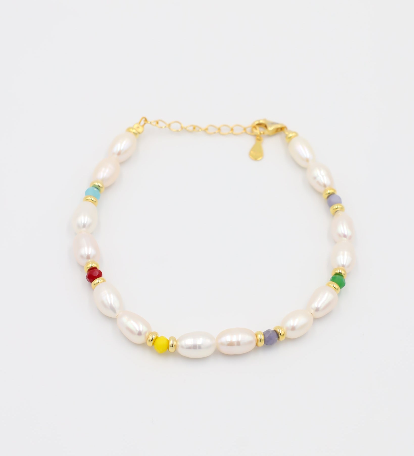 Adjustable gold-plated sterling silver pearl bracelet with colorful beads, Moe Gold, angled view.