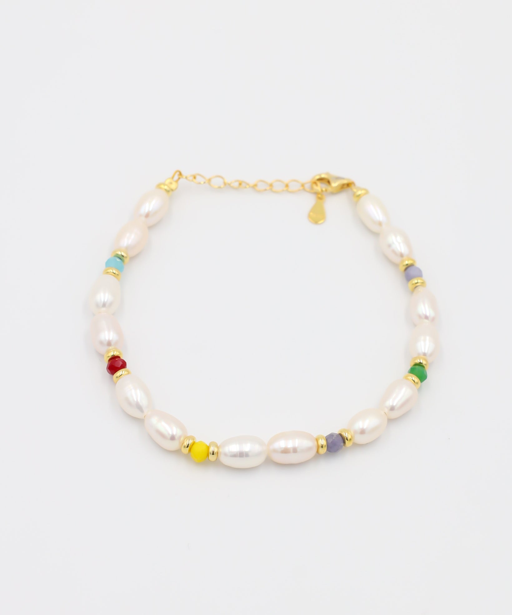 Adjustable gold-plated sterling silver pearl bracelet with colorful beads, Moe Gold, angled view.