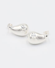 A pair of silver stud earrings with a butterfly clasp