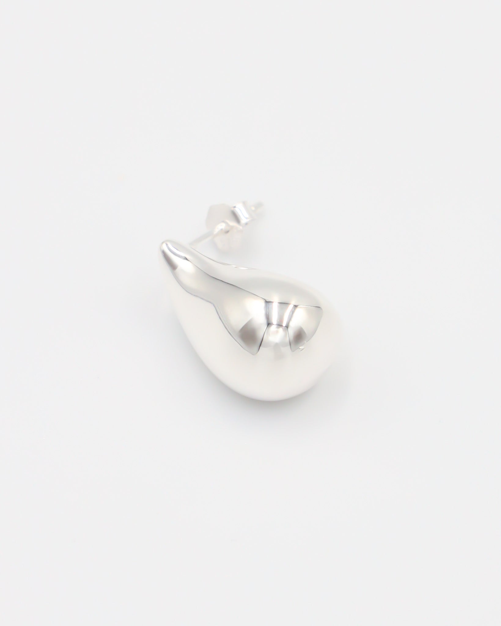 A pair of silver stud earrings with a butterfly clasp