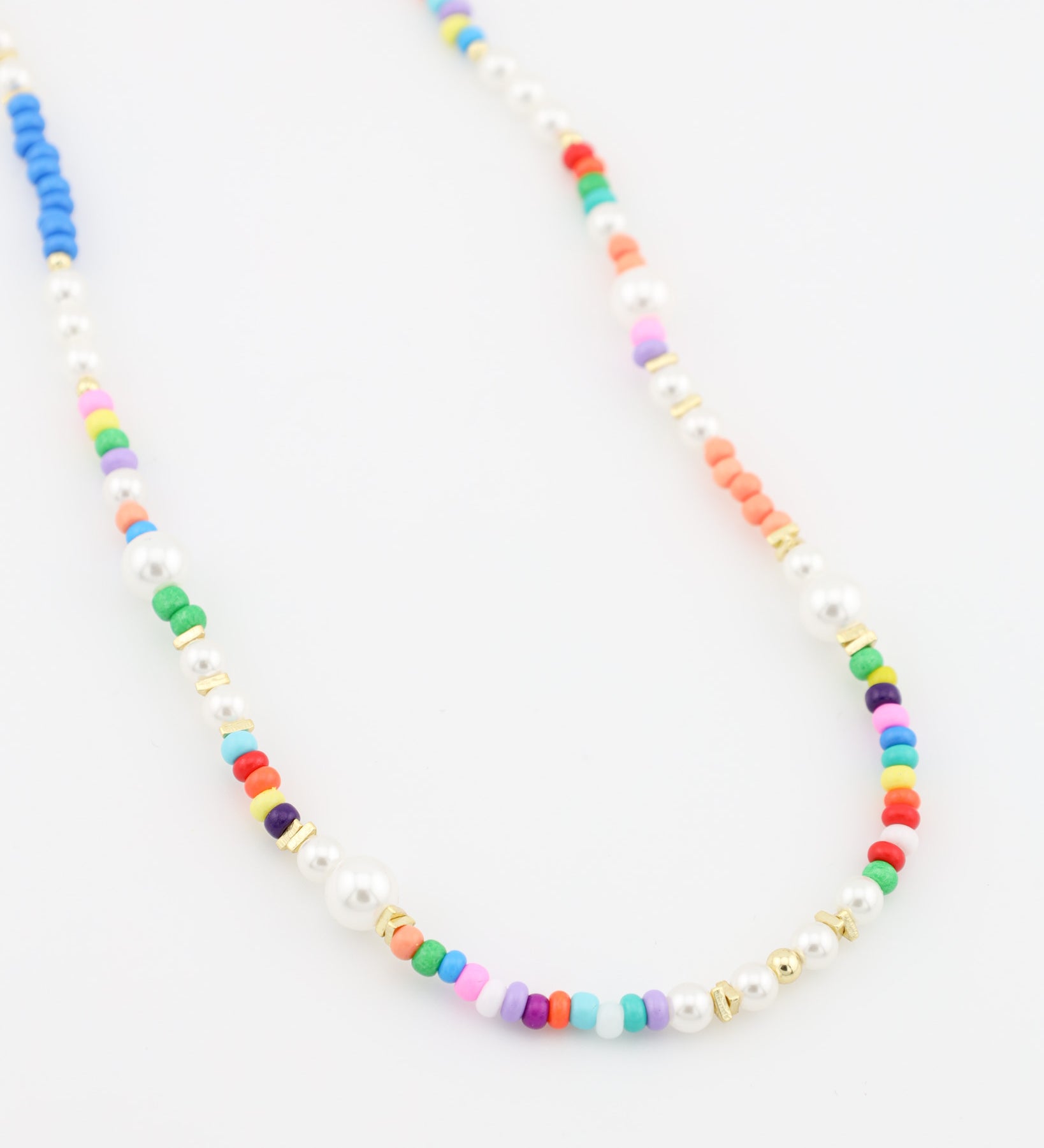 Necklace with multicolored beads on a white background