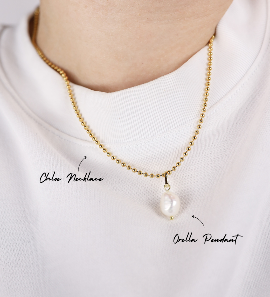 Gold necklace with a pearl pendant on a white background