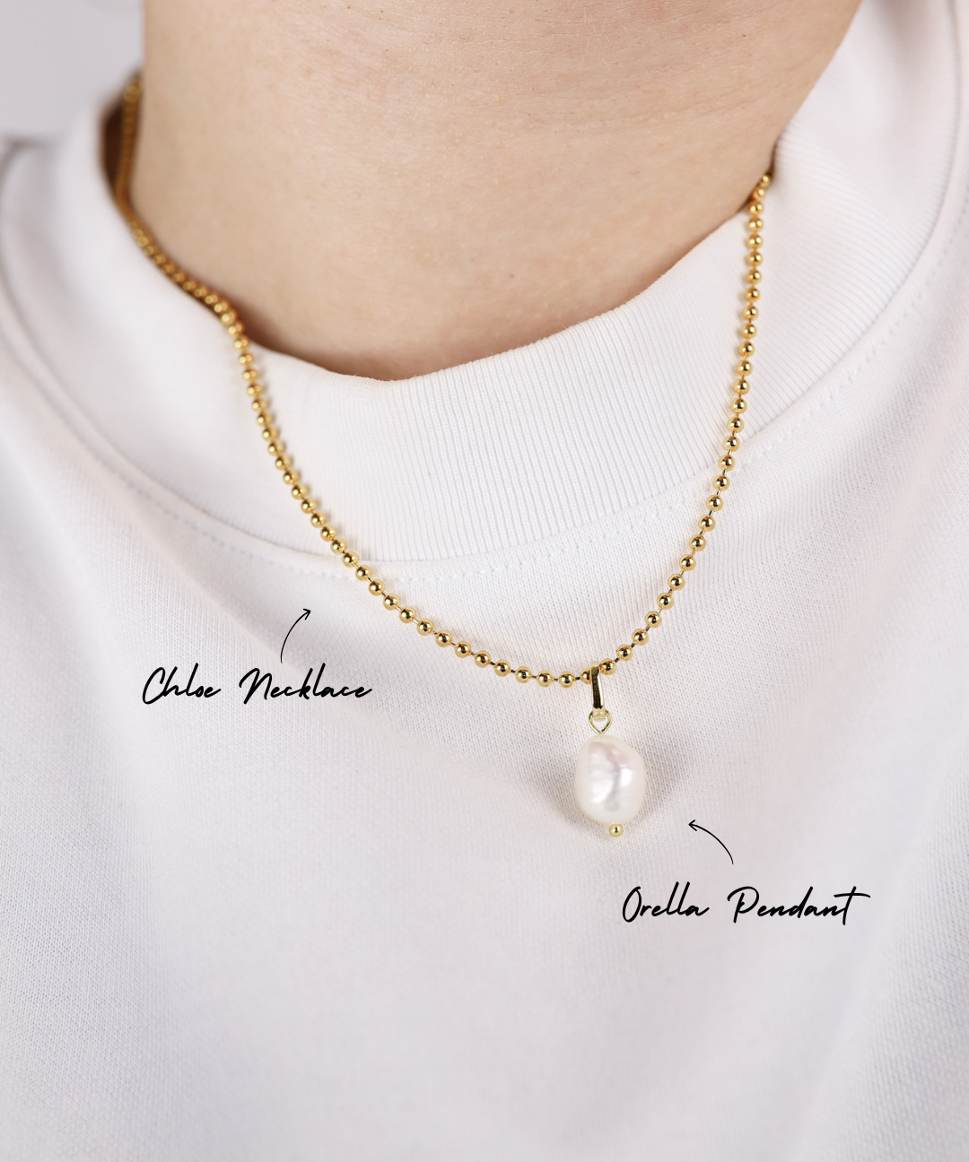 Gold necklace with a pearl pendant on a white background