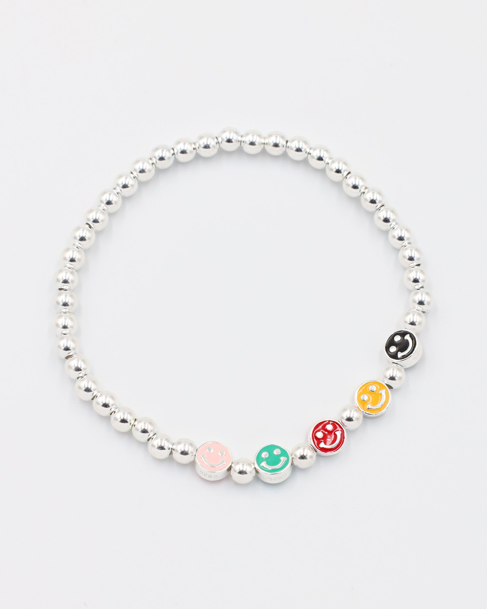Top view of adjustable sterling silver bracelet with colored smiley face beads and round silver beads.