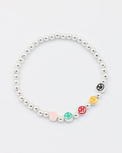 Top view of adjustable sterling silver bracelet with colored smiley face beads and round silver beads.