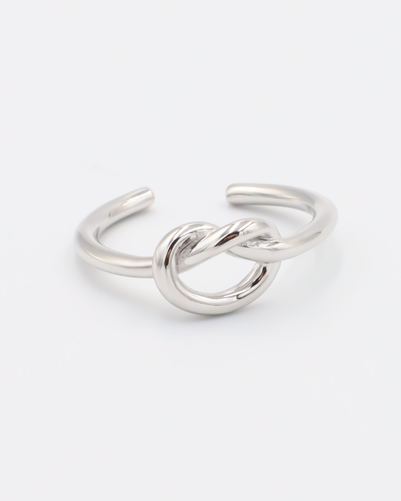 An adjustable silver ring with a infinity symbol design
