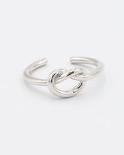 An adjustable silver ring with a infinity symbol design