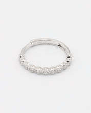 A silver ring with multiple stones set around its circumference.