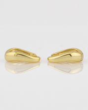 Pair of gold hoop earrings on a white background