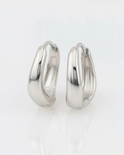 Pair of silver hoop earrings on a white background