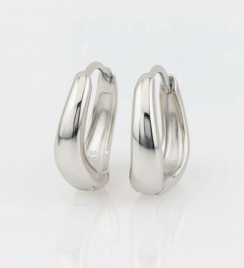 Pair of silver hoop earrings on a white background