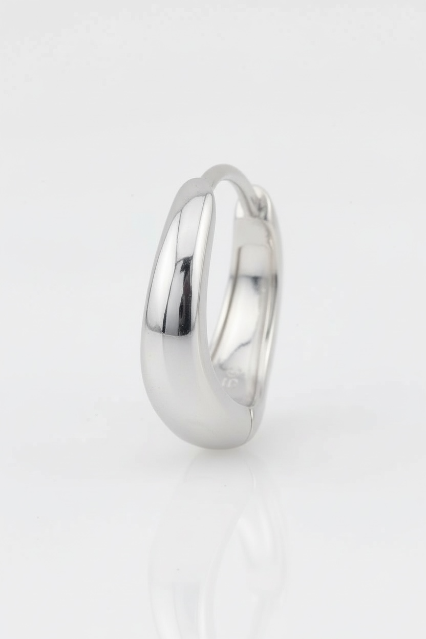 Silver ring on a light gray background