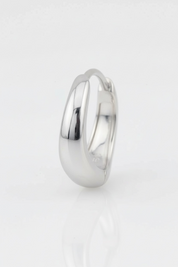 Silver ring on a light gray background