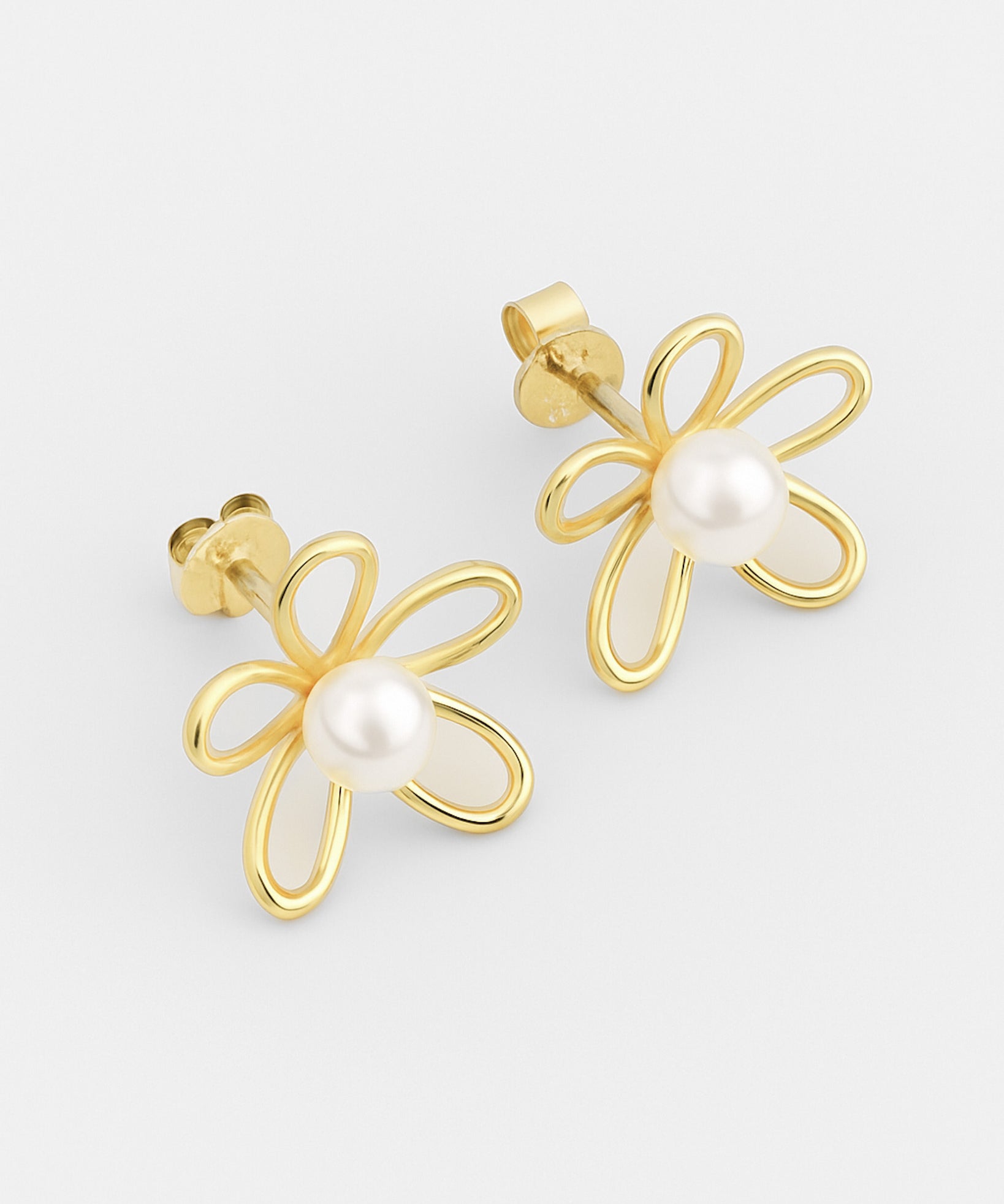Gold flower-shaped earrings with pearl centers on a light gray background