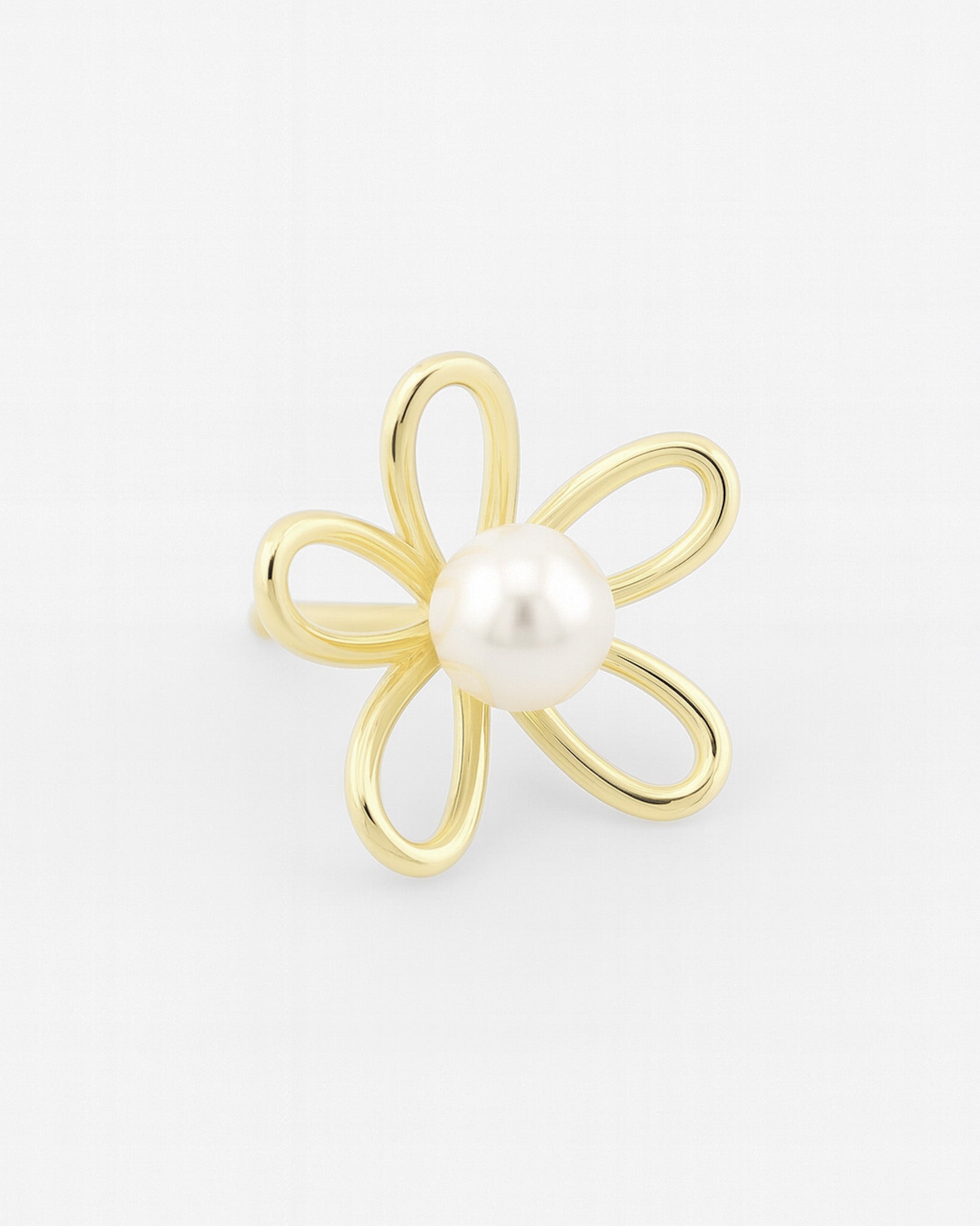 Gold flower-shaped earring with a pearl center on a light gray background