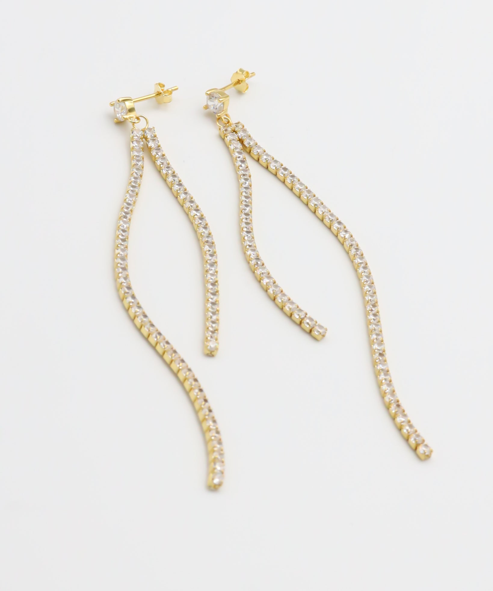 A pair of gold-colored stud earrings with small crystal embellishments.