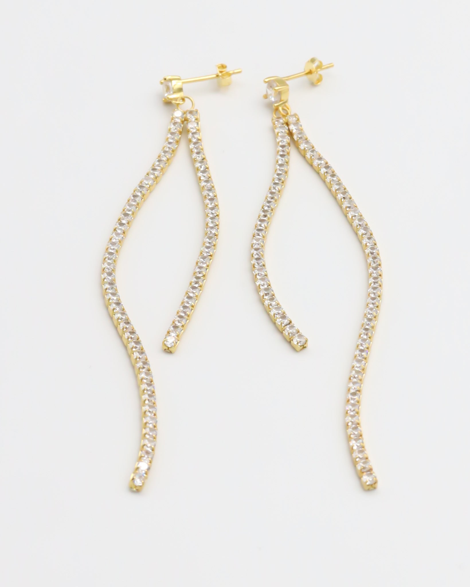 A pair of gold-colored stud earrings with small crystal embellishments.