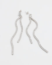 A pair of silver earrings with dangling crystal embellishments.