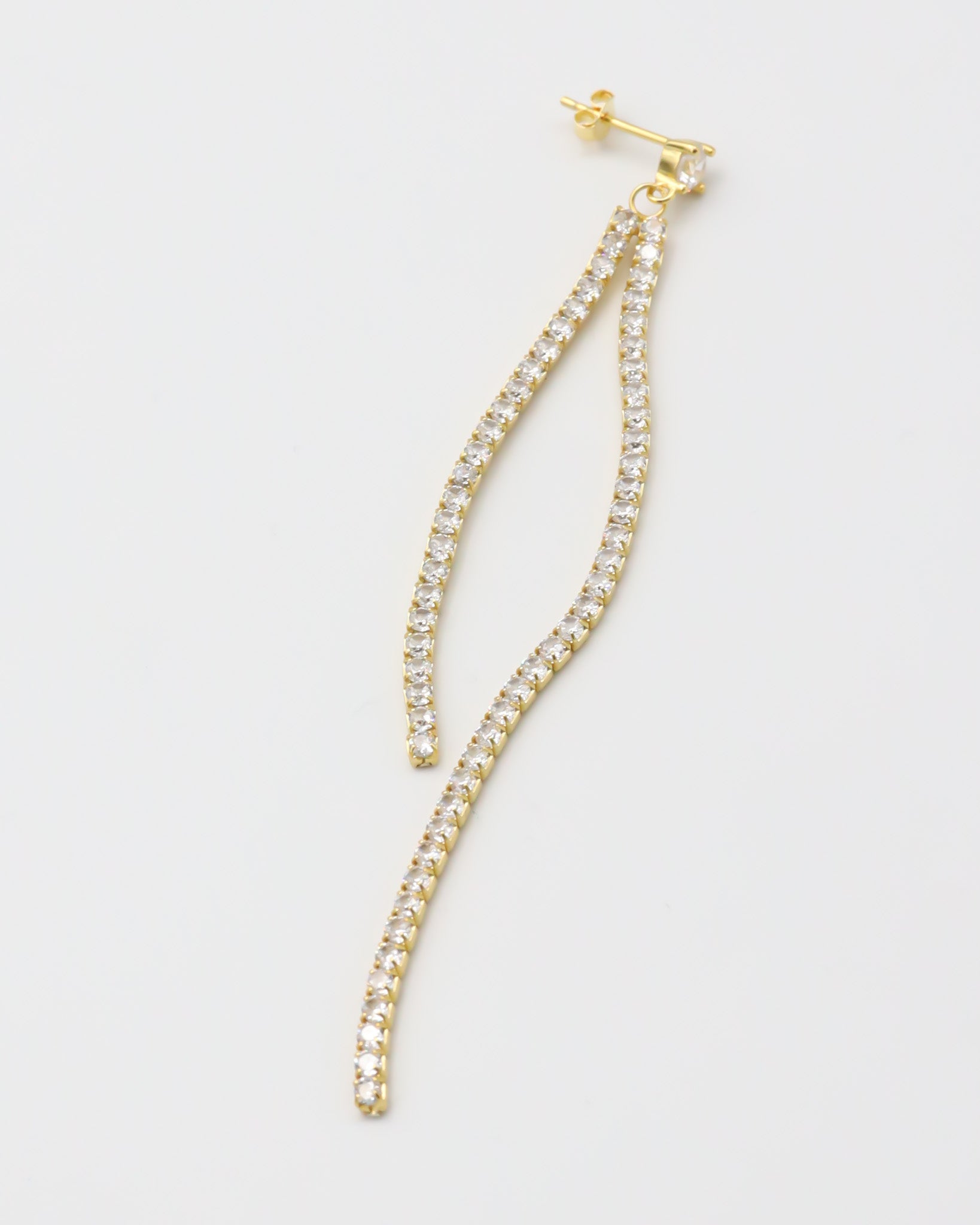 Gold colored silver earring with dangling crystal embellishments.