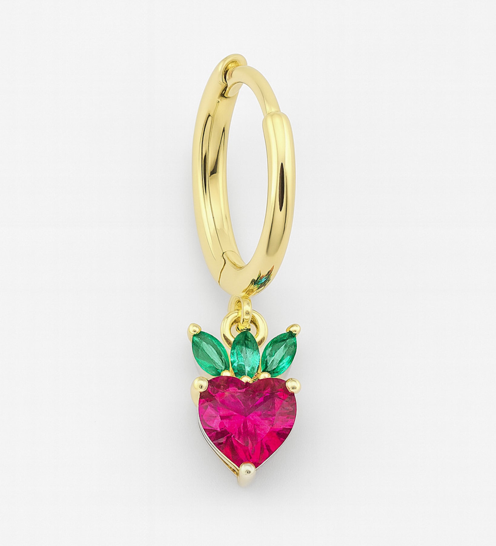 Gold hoop earring with a heart-shaped pink gemstone and green accents on a white background