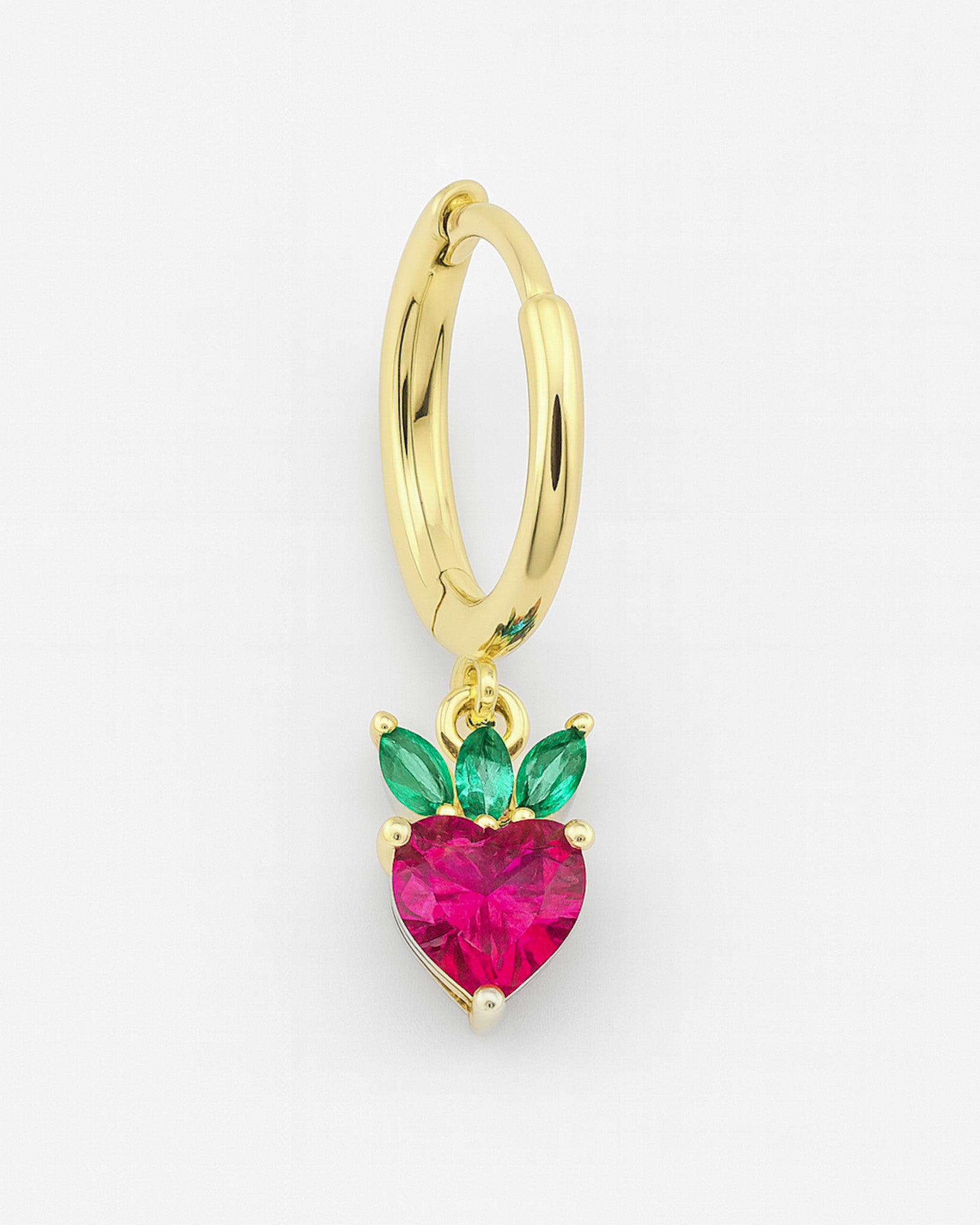 Gold hoop earring with a heart-shaped pink gemstone and green accents on a white background
