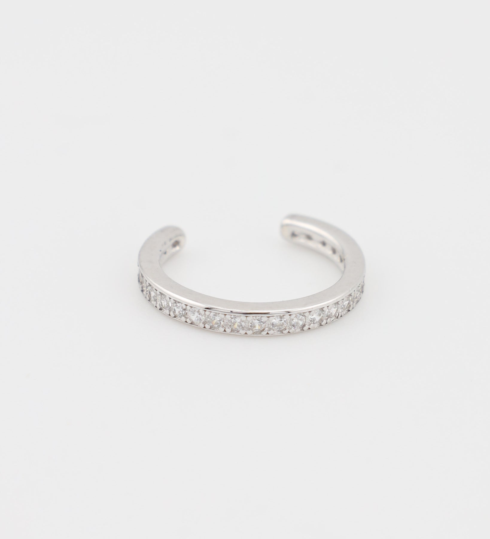 Silver bracelet with small stones on a white background