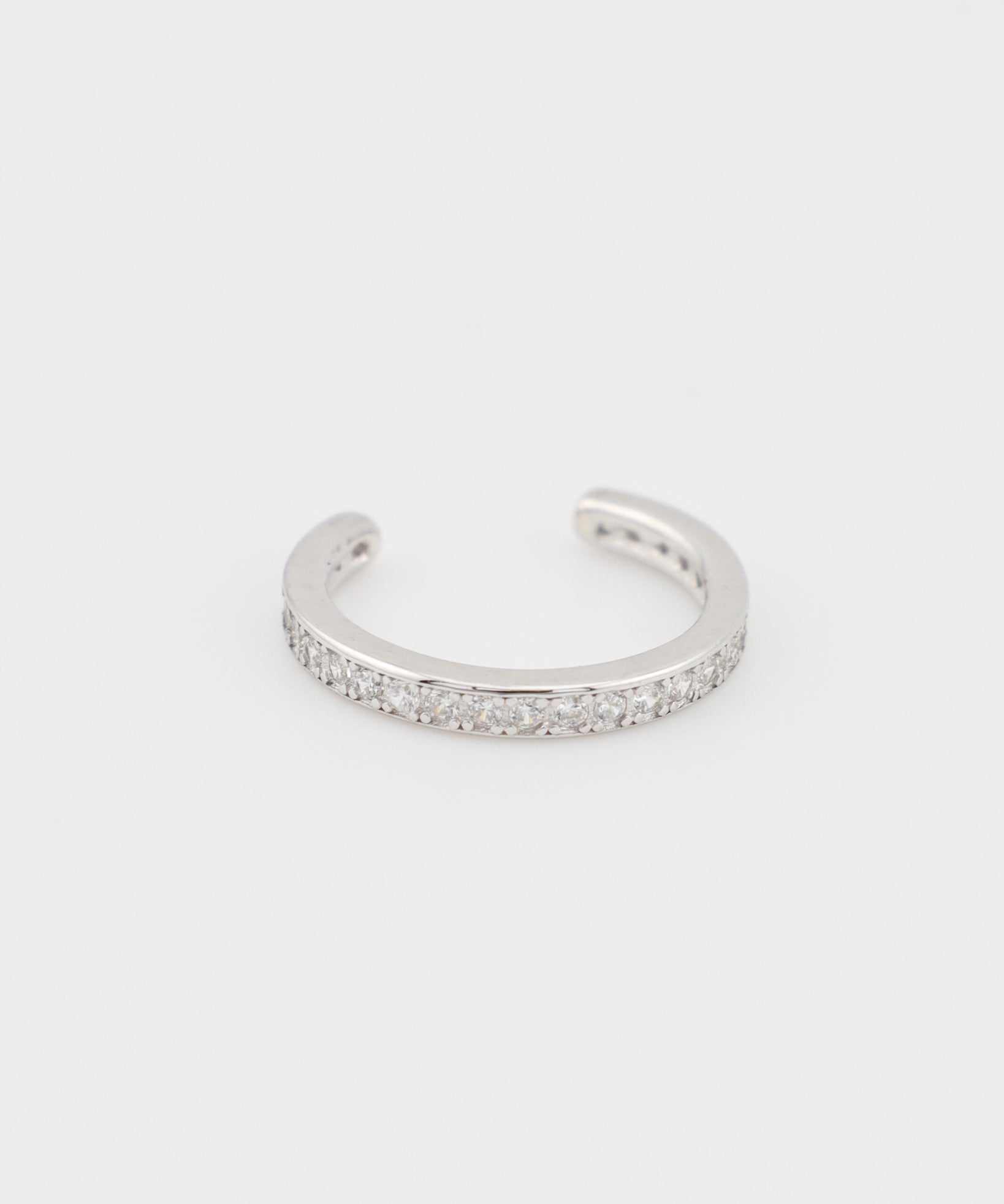 Silver bracelet with small stones on a white background