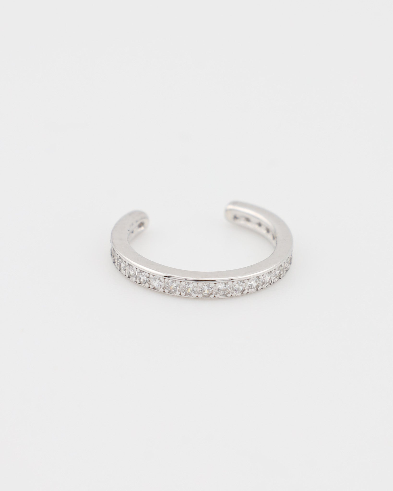 Silver bracelet with small stones on a white background