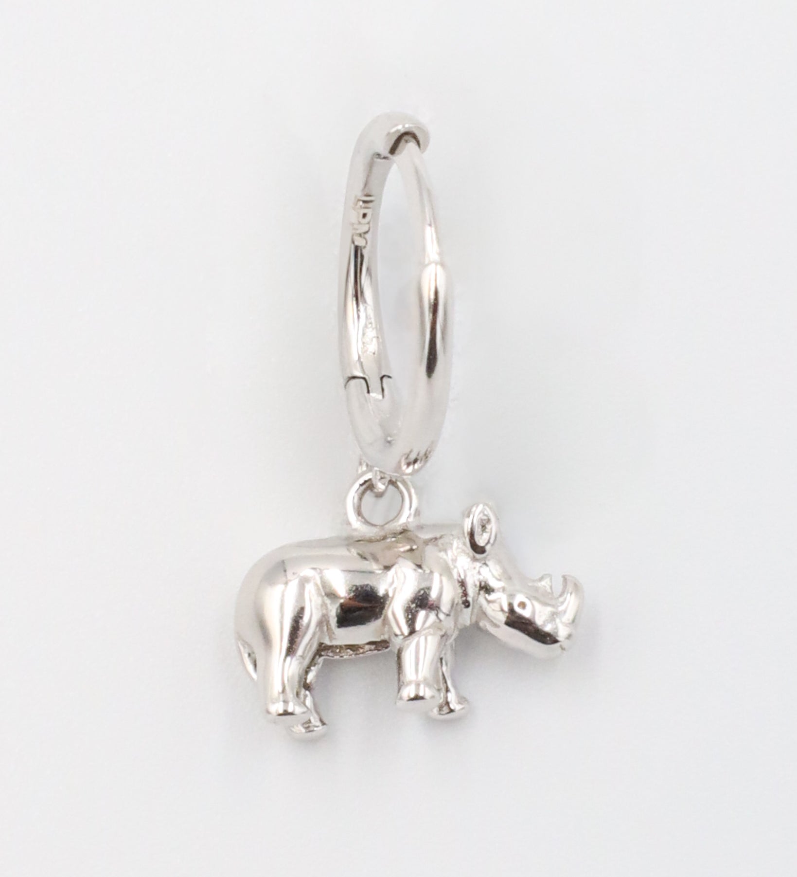 Sterling silver rhino hoop earring for the right ear.