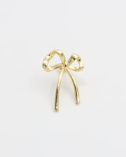 A single gold bow-shaped earring on a white background