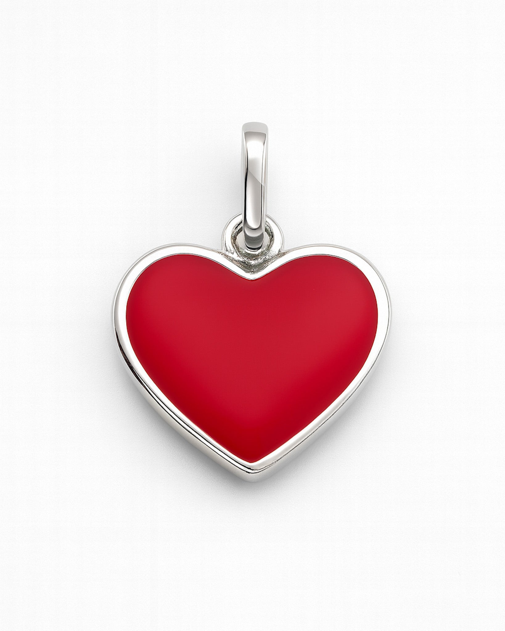Red heart-shaped pendant with silver border on a white background