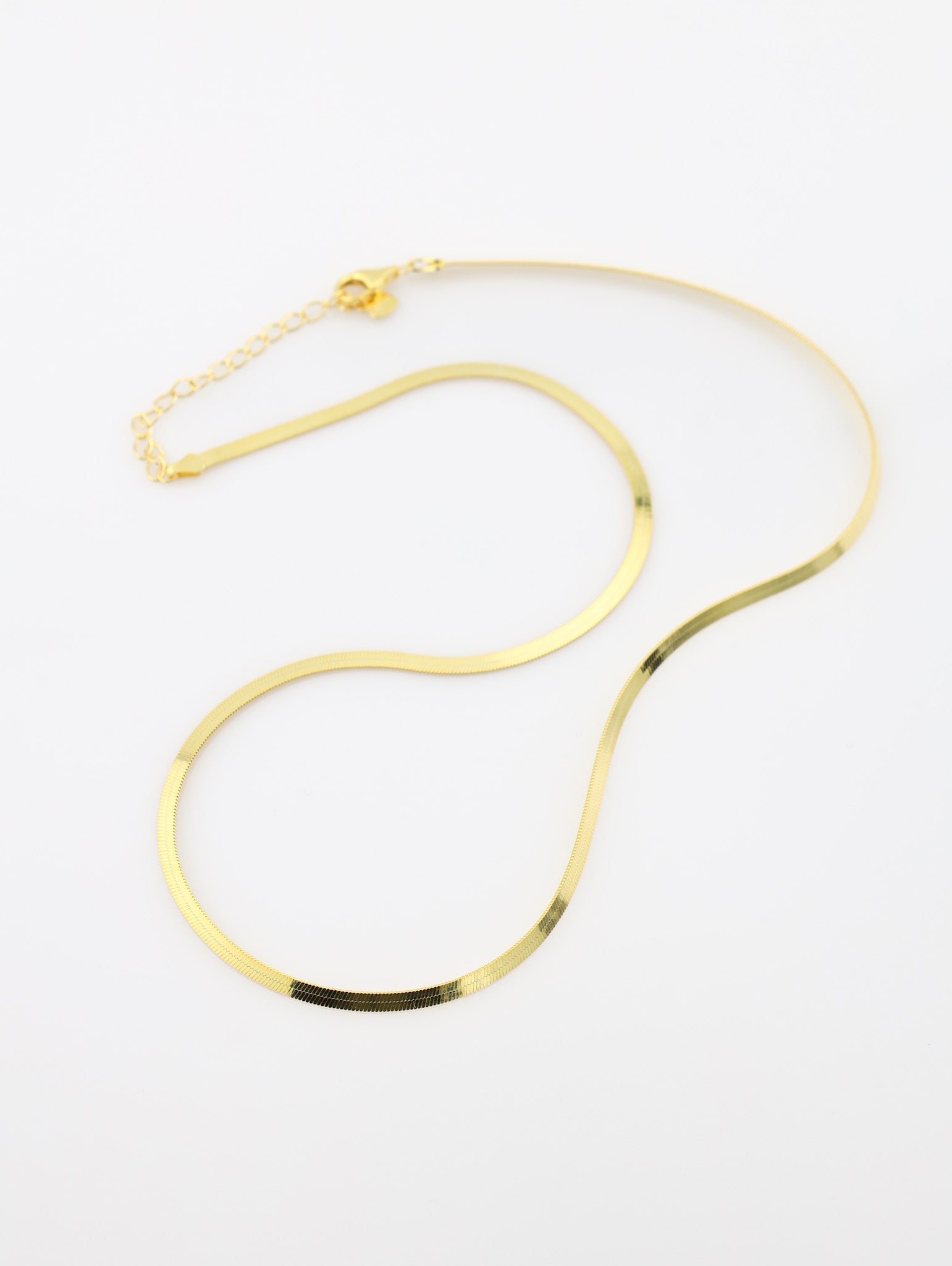 Gold necklace on a white background
