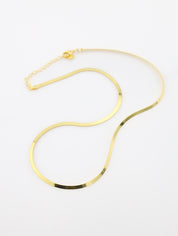 Gold necklace on a white background