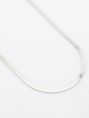 Thin white cable on a light gray background