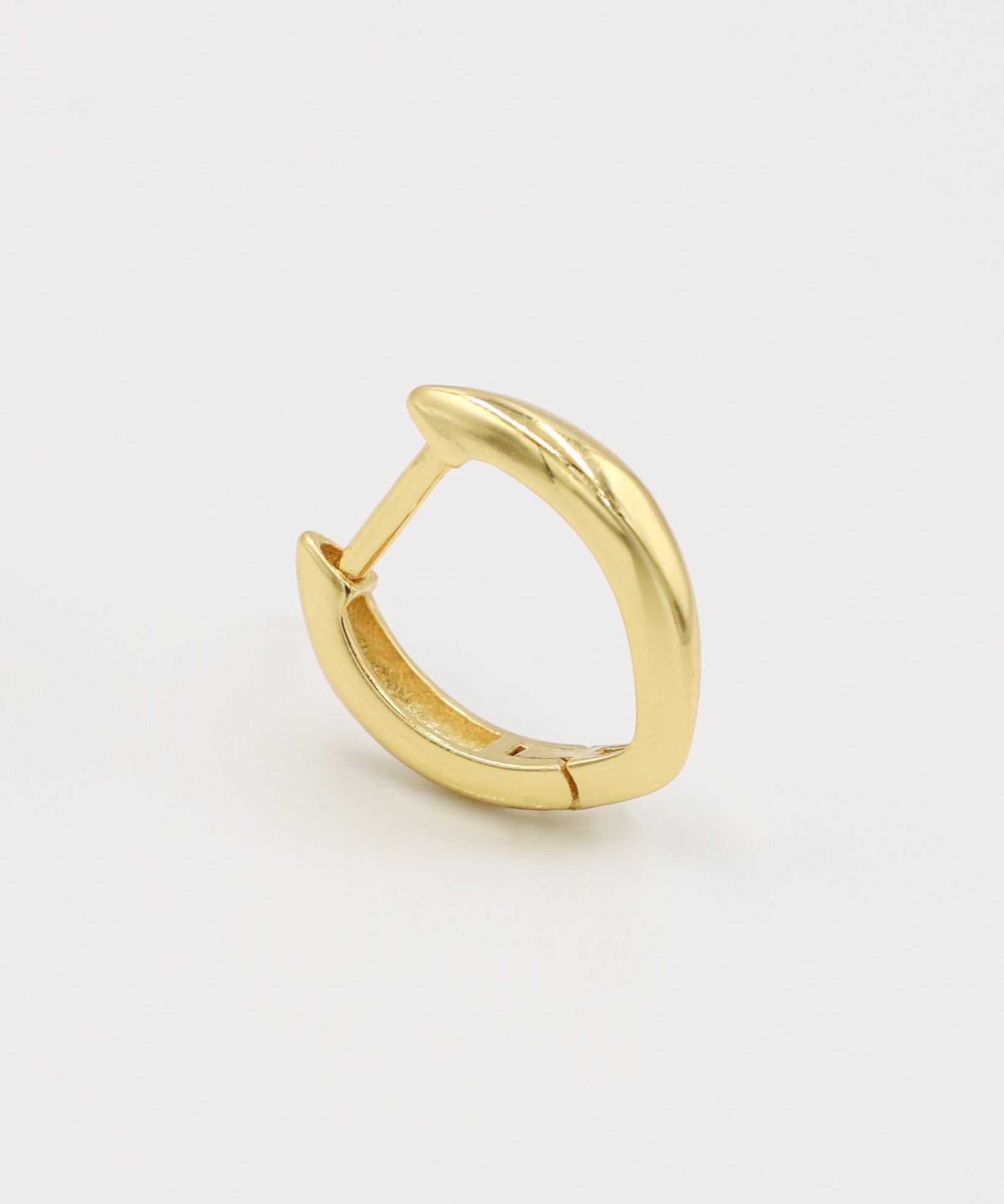 A single gold-colored hoop earring with a hinged clasp, displayed against a white background.