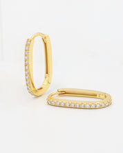 A gold hoop earring with a row of inset stones on the hoop, displayed against a white background.