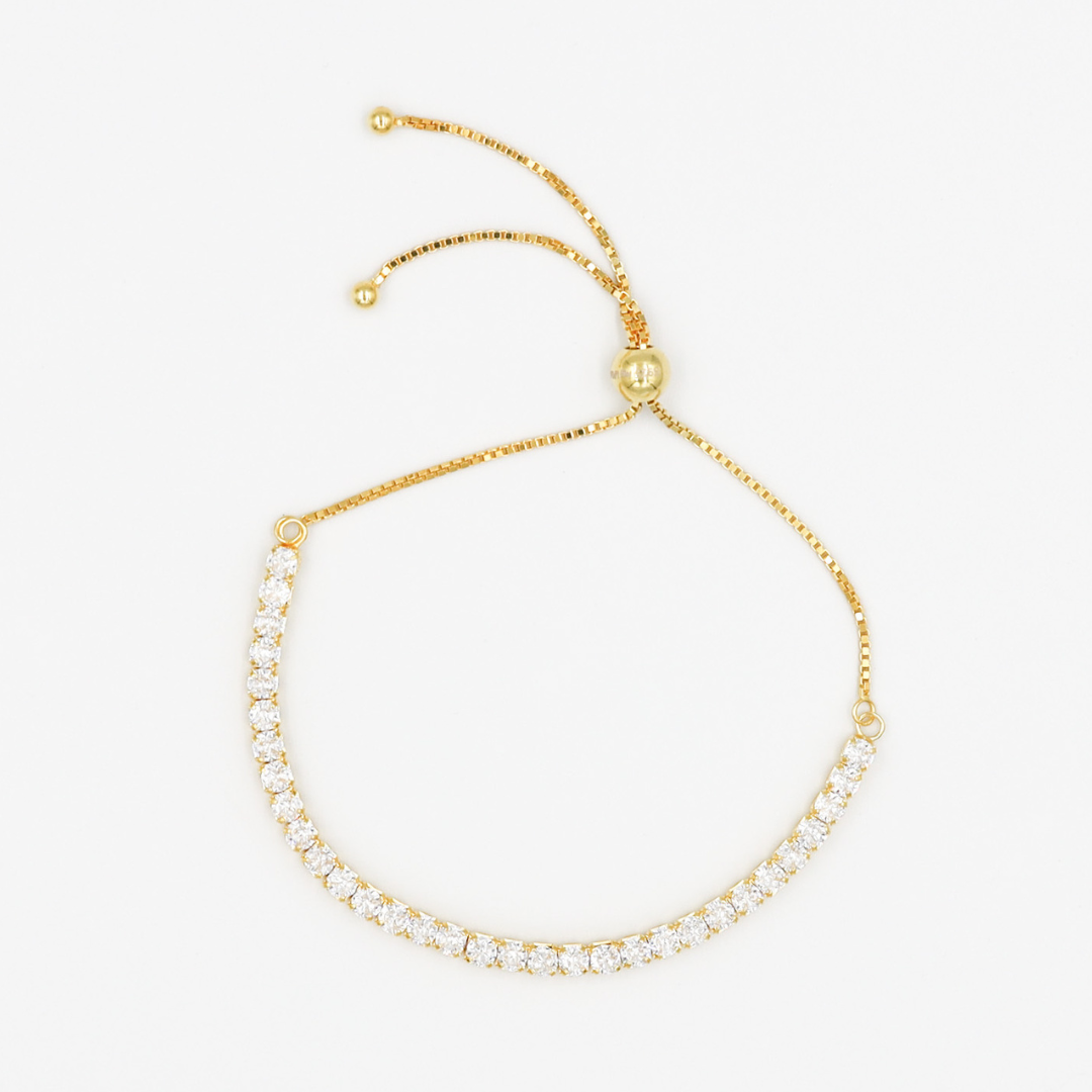 Adjustable gold-colored bracelet with round charms linked together on a white background.
