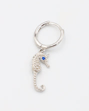 A close-up of a single silver hoop earring with a seahorse charm and a blue stone eye, displayed on a white background (Right Ear).
