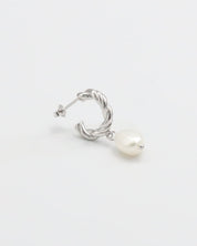 A single silver hoop earring with white pearl stud.