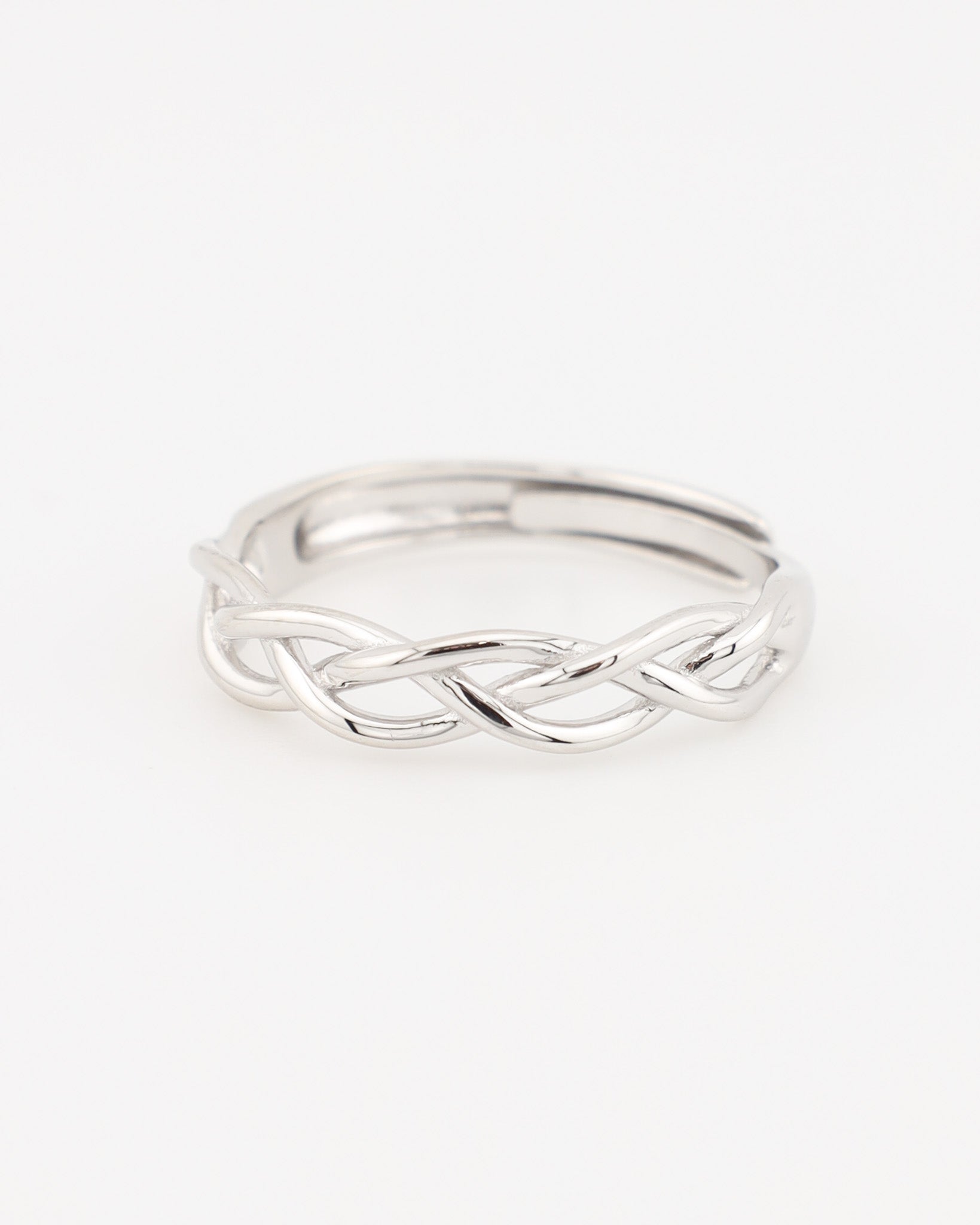Silver braided ring on a white background