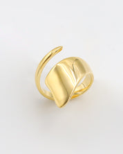 A single gold-colored ring on a white background.