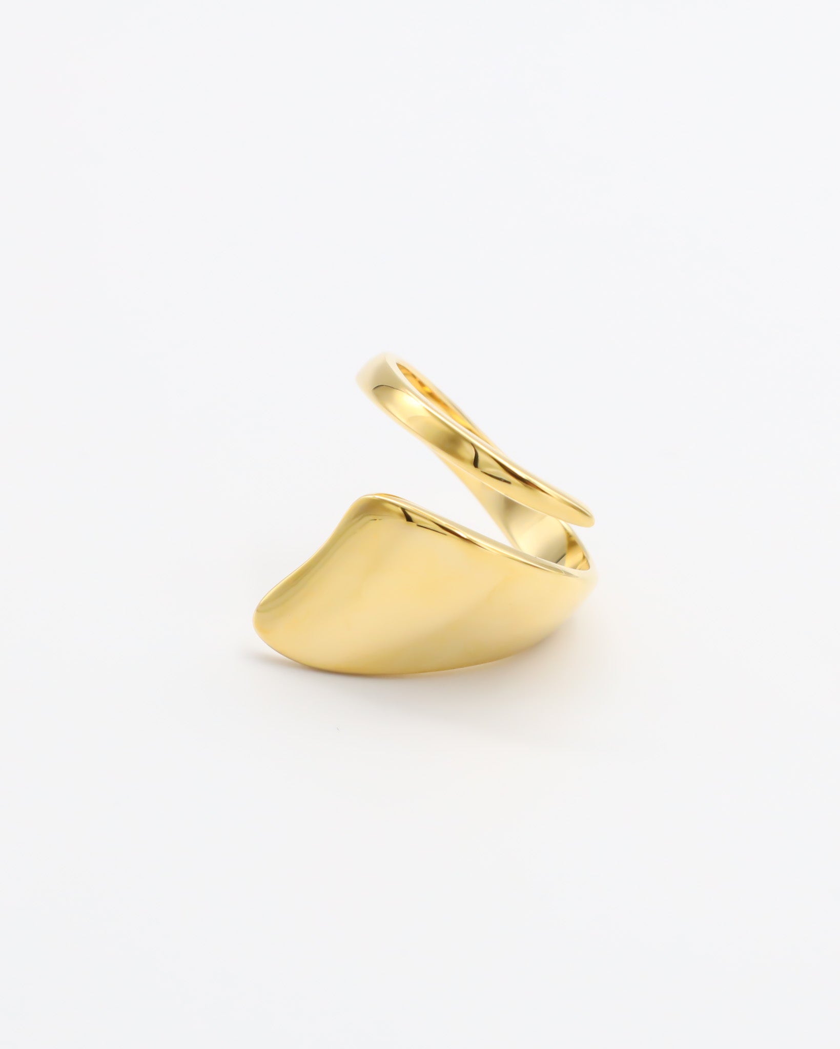 A single gold-colored ring on a white background.