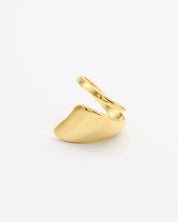 A single gold-colored ring on a white background.