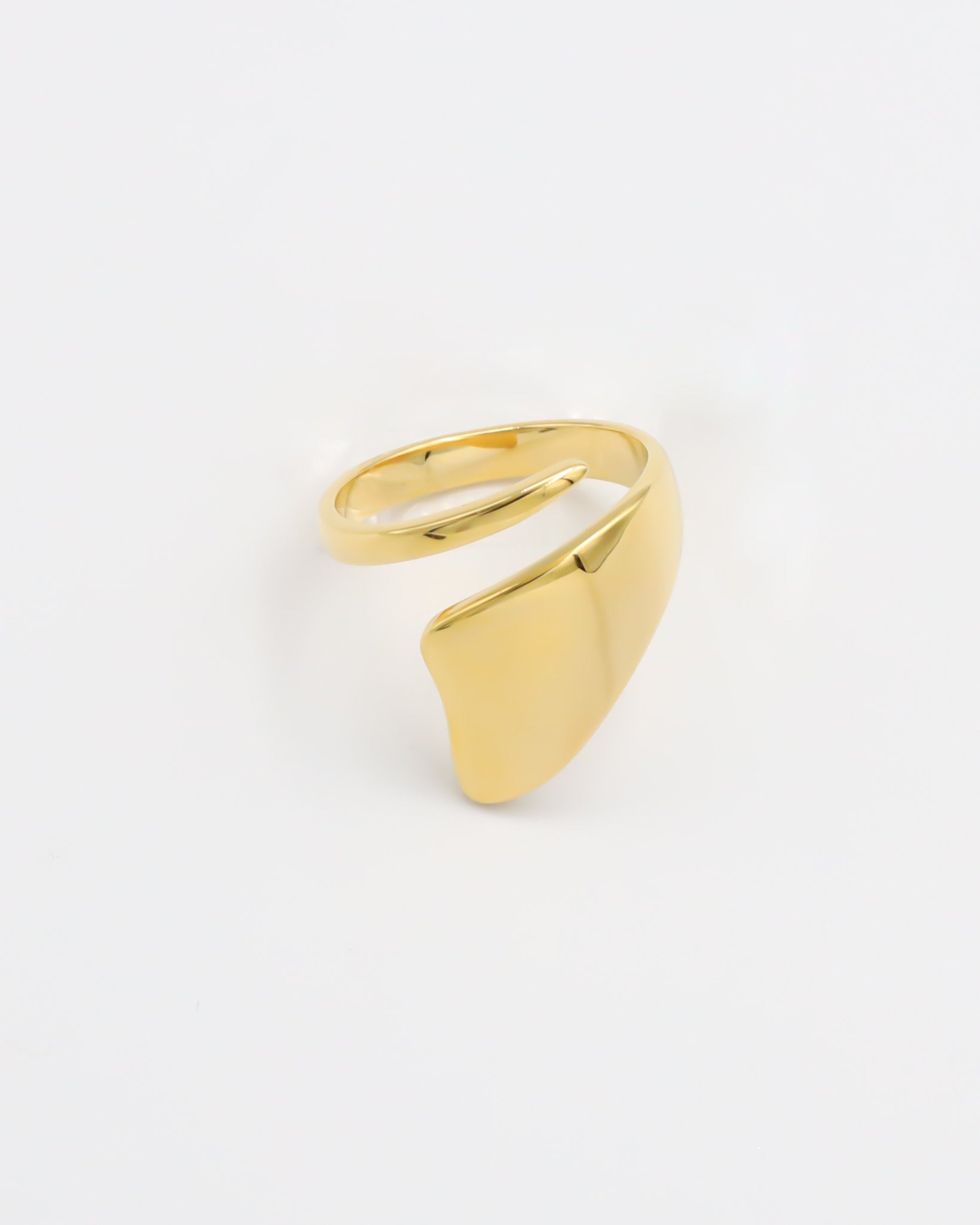 A single gold-colored ring on a white background.